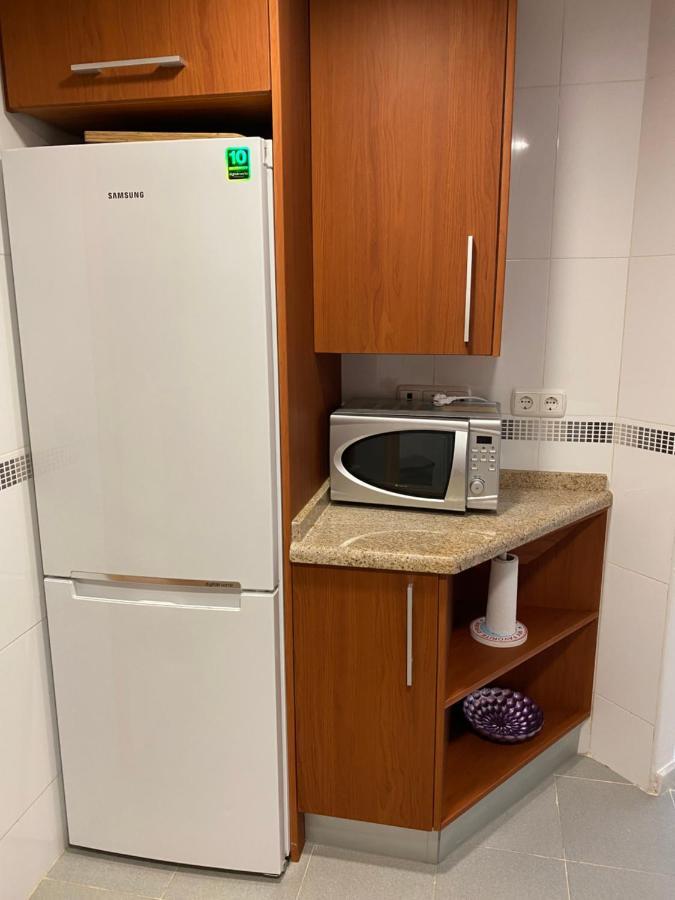 Elegant 2-Bedroom Apartment In Benidorm With Private Pool And Scenic Garden Views كالا دي فينيسترات المظهر الخارجي الصورة